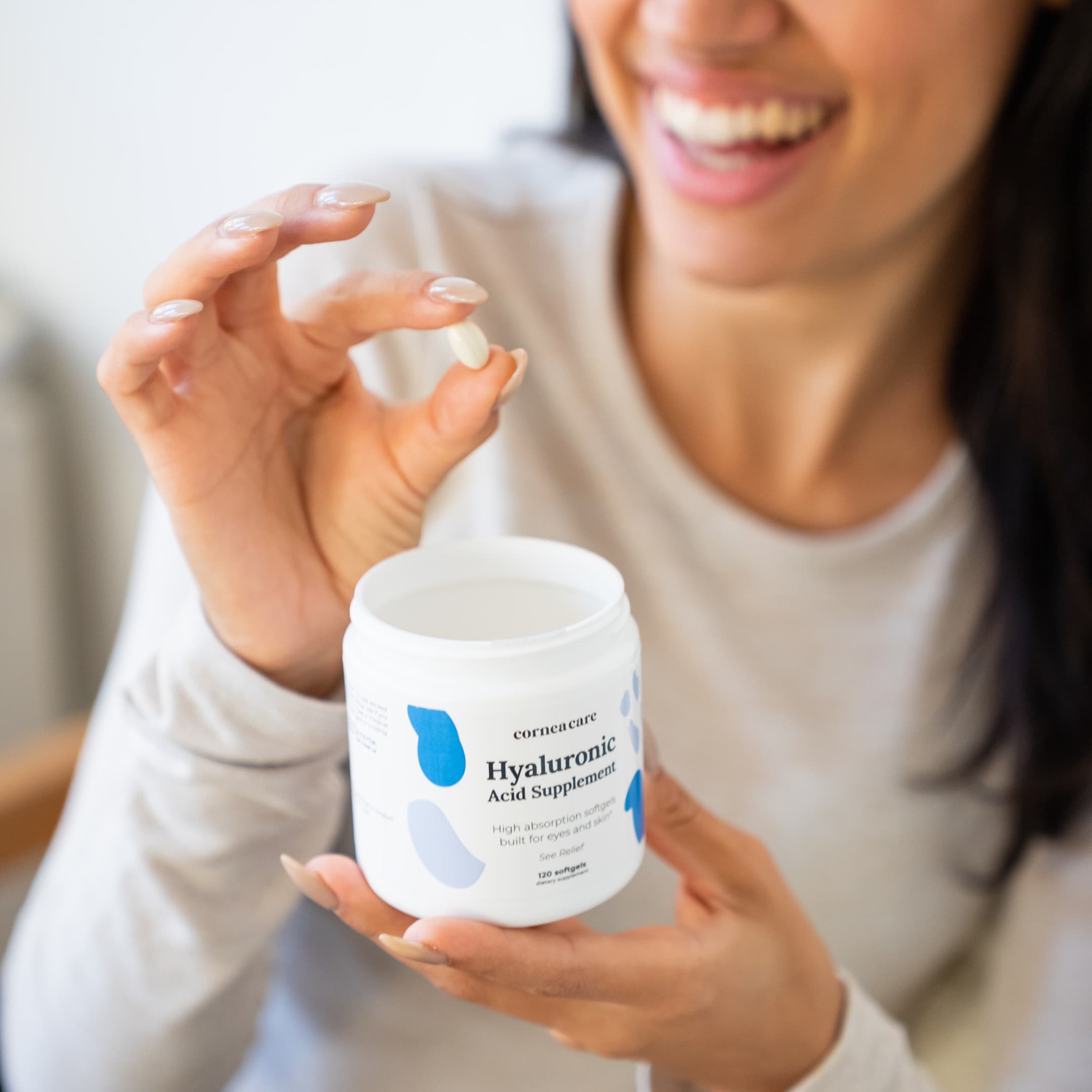 Hyaluronic Acid Supplement Model Holding Bottle and Supplement