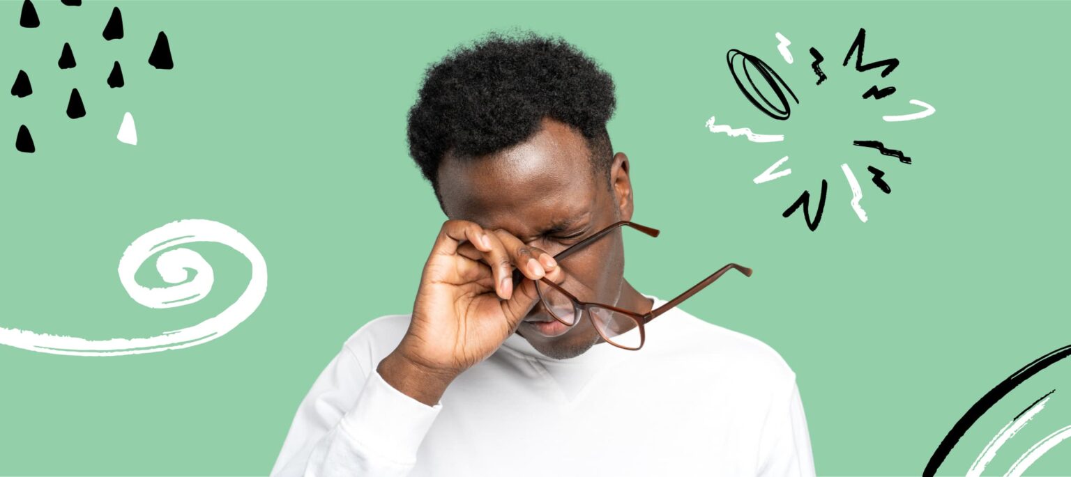 How long does eye strain last - man holding glasses
